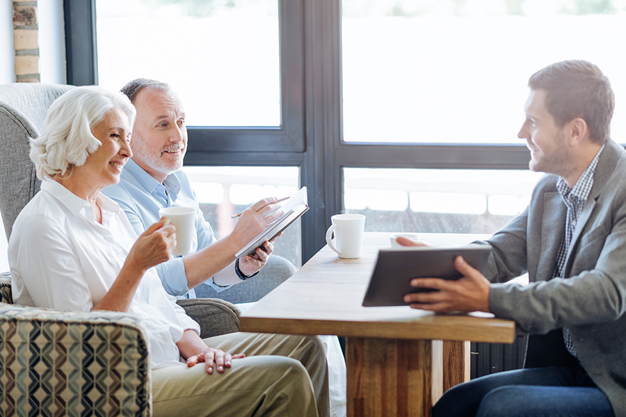 elder couple having a meeting with insurance agent at coffee shop dalton ga